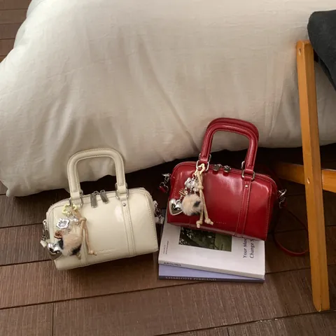 Women Vintage Boston Bag PU Leather Pillow Handbag With Pendants Elegant Commute Shoulder Crossbody Bag Minimalist Solid Color Retro Style Dual Handle Satchel