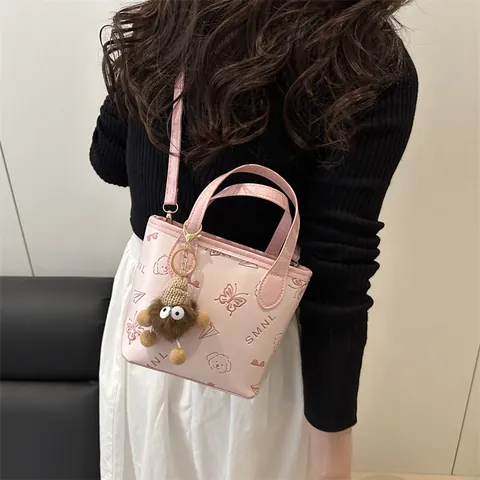 Women PU Leather Embossed Bucket Shoulder Bag With Plush Monster Keychain Small Cartoon Pattern Crossbody Handbag Fashion Bag