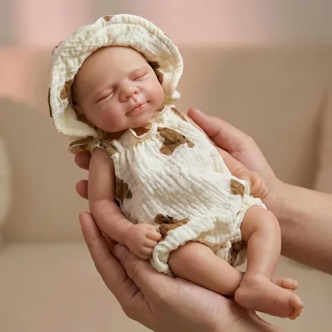 Realistic Full Body Silicone Solid Reborn Baby Doll Closed Eyes Lifelike Newborn Doll With Bear Print Outfit For Kids Gift