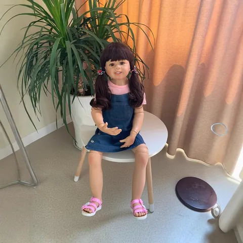 Lifelike Reborn Toddler Girl Doll Silicone Body Brown Hair Pink Shirt And Denim Pinafore Dress Decorative Model Doll