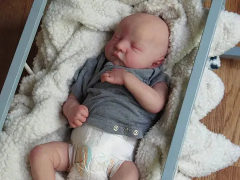 Handmade Realistic Reborn Baby Doll Soft Silicone Limbs Cotton Body Sleeping Newborn Toy With Grey Short Sleeve Romper
