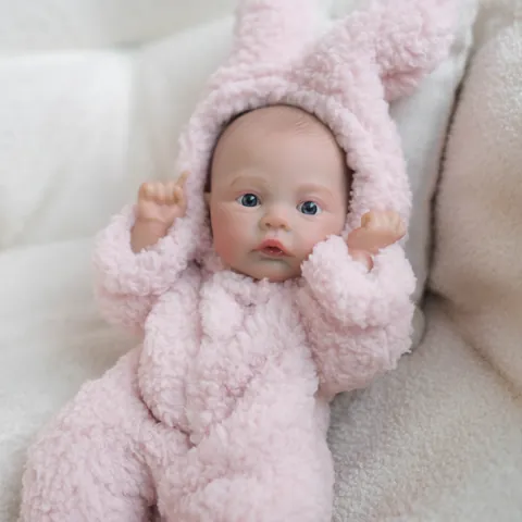 Bambola Reborn Realistica Con Grenouillère in Peluche Rosa a Forma di Coniglio Corpo in Vinile Morbido Regalo Bambina