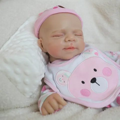 Lifelike Reborn Baby Doll Solid Silicone Full Body Sleeping Simulated Newborn Doll With Pink Bear Outfit Bib Hat Gift