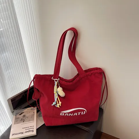 Women Casual Nylon Drawstring Tote Bag BANATU Letter Print Large Capacity Shoulder Bag With Plush Pendant Daily Handbag