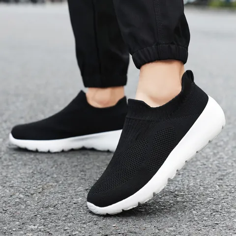 Men Casual Flyknit Slip On Sneakers Lightweight Breathable Mesh Walking Shoes Black White Comfortable Loafers For Daily Wear