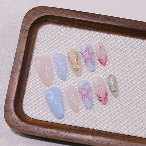 Unghie Finte Artigianali Tema Oceano Decorazioni Stella Marina Künstliche Perle 3D Blu Chiaro Rosa Gel Nail Tips Forma a Mandorla Gioielli