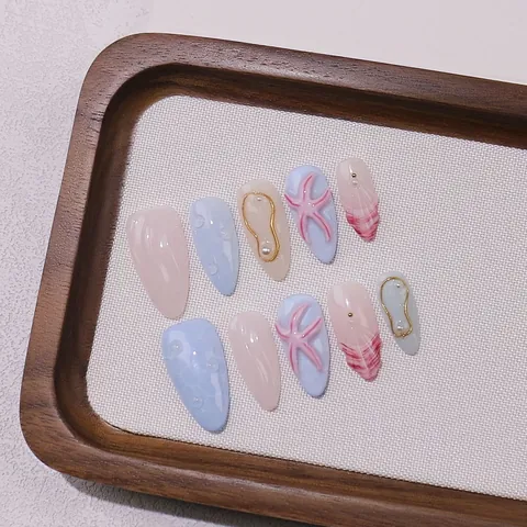 Unghie Finte Artigianali Tema Oceano Decorazioni Stella Marina Künstliche Perle 3D Blu Chiaro Rosa Gel Nail Tips Forma a Mandorla Gioielli