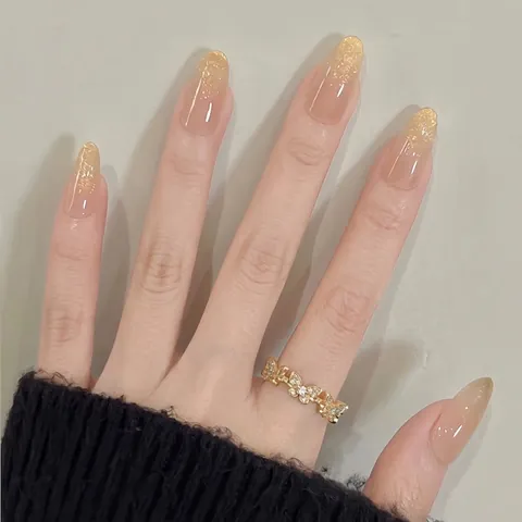 Unghie Finte a Pressione Francesi con Sfumatura Glitter Oro Lusso Champagne Scintillante Rosa Nudo Forma a Mandorla per Donna