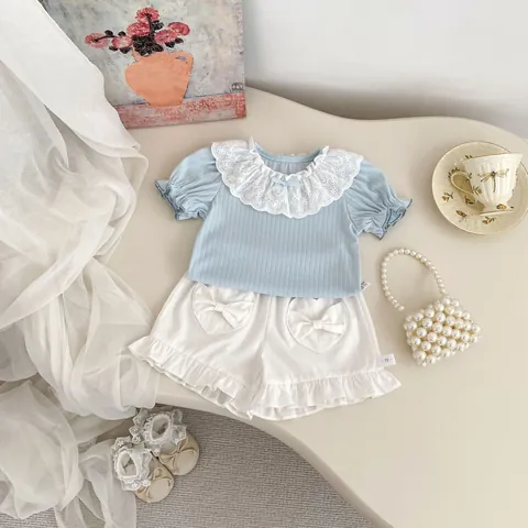 Toddler Girl Summer Clothing Set Lace Peter Pan Collar Ribbed Short Sleeve Top And White Heart Pocket Ruffle Shorts Outfit