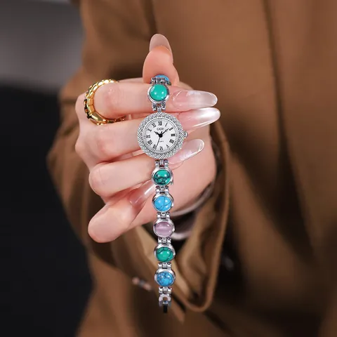 Montre à Quartz Bracelet Vintage Femme Boîtier Alliage de Zinc Verre Minéral Résistant à l'Eau Chiffres Romains Bijou