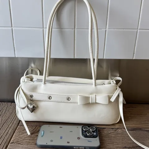 Women Y2K PU Leather Baguette Bag With Heart Pendant Bow Decor Underarm Shoulder Bag For Commuting Daily Fashion Handbag