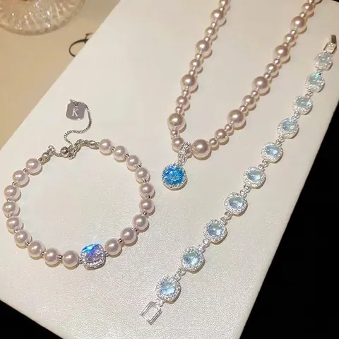 Set di Gioielli in Perla Artificiale e Zirconia di Lusso per Donna Elegante Collana e Bracciale con Pendente Rotondo Argento