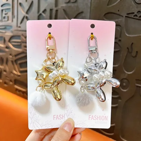 Electroplated Balloon Dog Keychain with Artificial Pearl and Pom-Pom Star Charm for Bags Car Keys Cute Women Gift Pendant