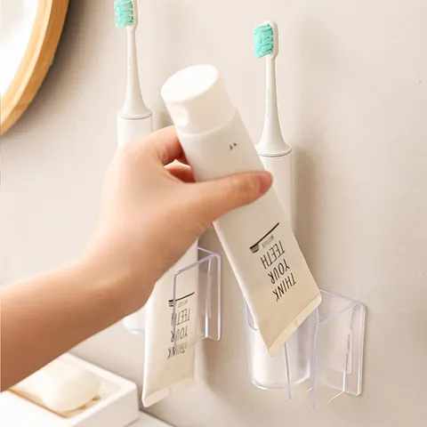Wandmontierter Elektrischer Zahnbürstenhalter Selbstklebender Zahnpasta Lagerregal Transparenter Kunststoff Badezimmer Organizer Wasserdichtes Abtropfregal