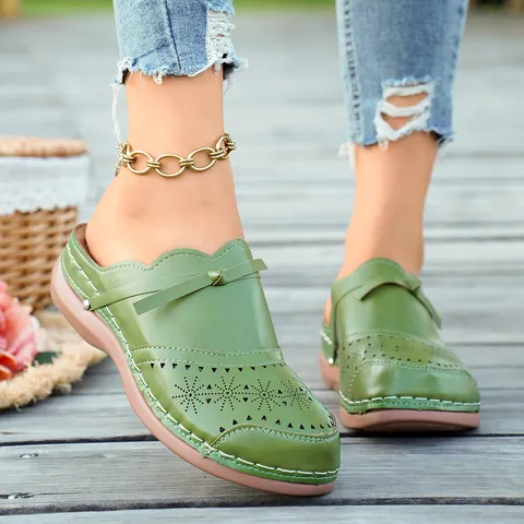 Women's Summer Flat Mules Bow Laser-Cut Floral Hollow Closed Toe Sandals Comfortable PU Leather Ethnic Style Casual Slides