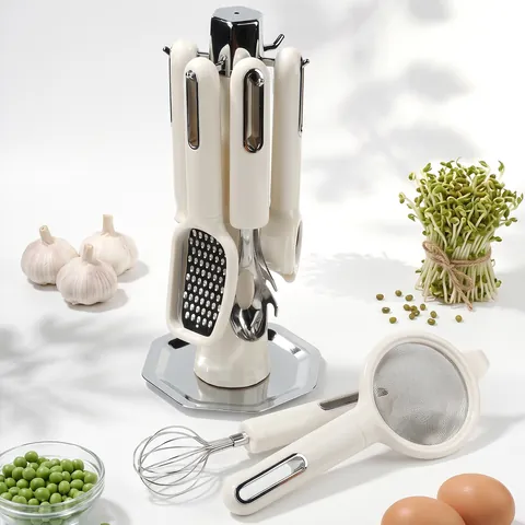 7-Piece Stainless Steel Kitchen Gadget Set With Vertical Rotating Storage Rack Cream White ABS Handle Peeler Whisk Bottle Opener Grater Sieve For Baking Cooking