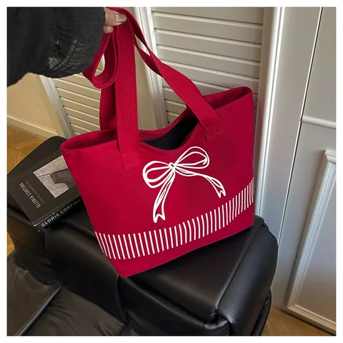 Große Kapazität Minimalistische Segeltuch Umhängetasche Für Damen Schleife Druck Design Vielseitige Tote Bag Alltagstasche