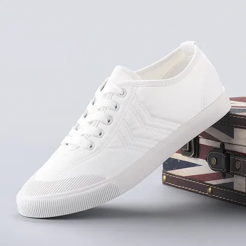 Women Casual Canvas Shoes Low Top Vulcanized Board Shoes Fashion Solid Color Lace Up Sneakers With V-Shaped Stitching Design