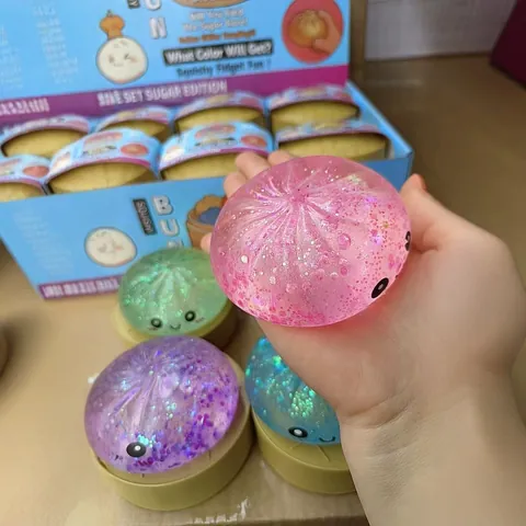 Giocattolo Squishy a Forma di Panino al Vapore Realistico in Morbido Silicone Antistress Giocattolo da Spremere con Imbottitura Glitterata Carino Viso Sorridente Giocattolo Sensoriale