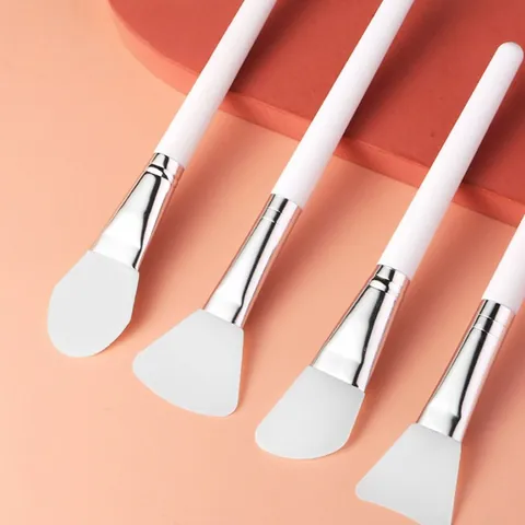 Professional Silicone Facial Mask Brush for Mud Mask Application Portable Beauty Tool with White Handle and Silver Tube