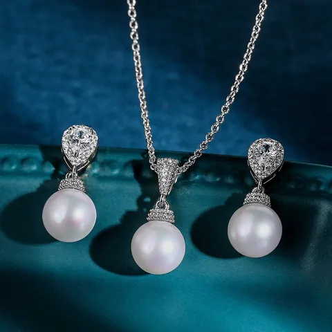 Elegantes Künstliche Perle Zirkonia Schmuckset Messing Eingelegter Anhänger Halskette Und Ohrringe Für Hochzeit Brautjungfer Schmuck