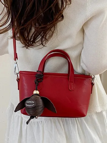 Petit Sac Seau pour Femmes Sac à Main en Cuir PU Mode Navette Sac à Bandoulière avec Pendentif Décoratif Fermeture Éclair Couleur Unie