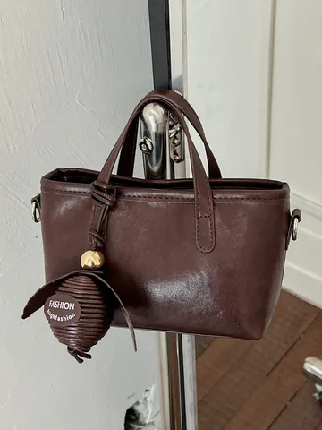 Petit Sac Seau pour Femmes Sac à Main en Cuir PU Mode Navette Sac à Bandoulière avec Pendentif Décoratif Fermeture Éclair Couleur Unie