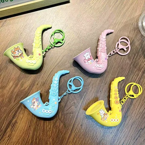 Llavero de Saxofón de Juguete Musical de Plástico ABS Mini Colgante de Instrumento Dibujos Animados Alivio del Estrés