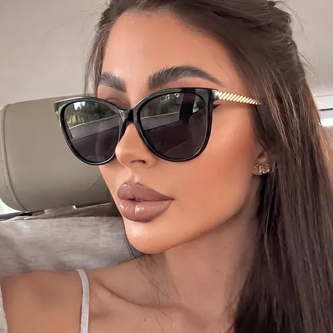 Lunettes de Soleil Œil de Chat Vintage pour Femmes Retro Branche Torsadée en Métal Protection UV400 Verres PC Mode Femme