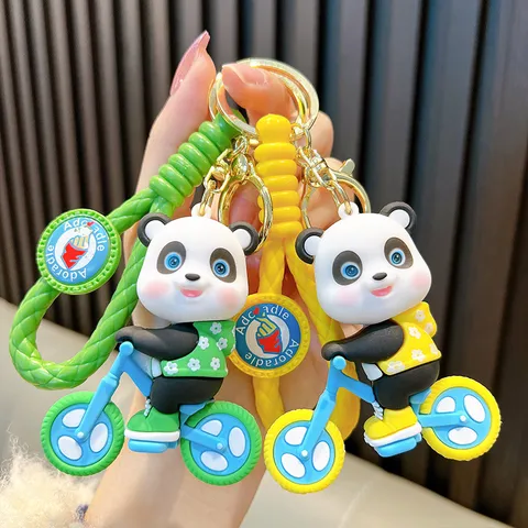 Cartoon Panda Riding Bicycle Keychain PVC Soft Glue 3D Animal Figure Bag Charm Woven Strap Pendant For Women Kids Gift