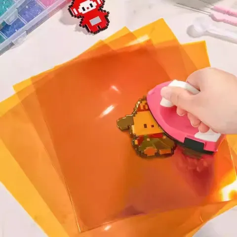 Papier à Repasser Résistant à la Chaleur pour Perler Beads Outil de Bricolage Effet Miroir Brillant Film Protecteur Ambre Translucide