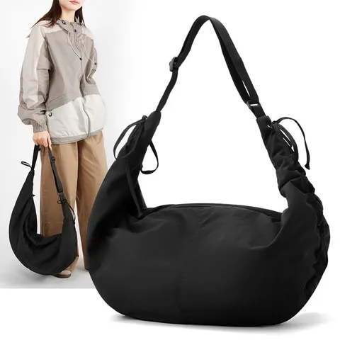 Women Large Capacity Pleated Moon Hobo Bag Nylon Waterproof Dumpling Crossbody Bag Minimalist Commuter Shoulder Bag With Hanging Ribbon