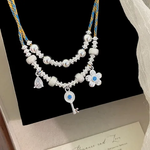 Collana a Strati Etnica Vintage da Donna in Rame Zirconia Chiave Fiore Ciondolo Corda Intrecciata Catena Clavicola con Perline