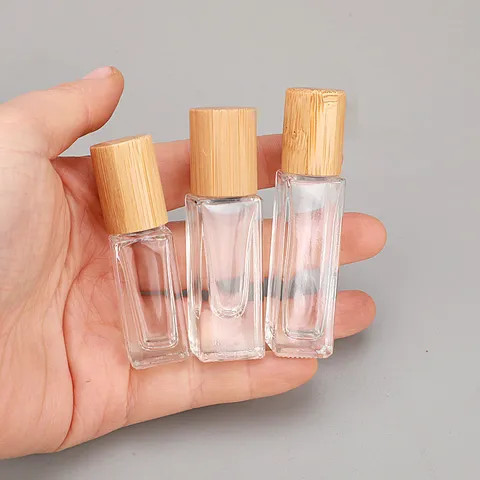Draagbare Glazen Parfum Rollerfles Essentiële Olie Sub-verpakkingsfles Met Bamboe Deksel En Stalen Bal Reisdispenser