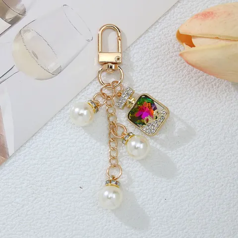 Fashion Artificial Pearl Rhinestone Perfume Bottle Keychain Pendant Women Girly Bag Charm Key Ring Jewelry Gift Accessory
