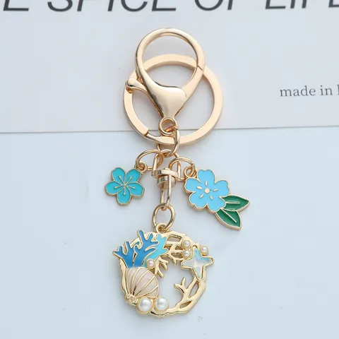 Joli Porte-clés en Alliage de Zinc Style Océan Émail Fleur de Cerisier Étoile de Mer Coquillage Pendentif de Sac Décoration Avec Perle Artificielle