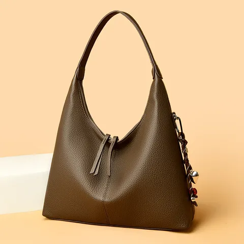 Slouchy Genuine Leather Bucket Tote Bag For Women Elegant Commuter Pebbled Leather Texture Large Capacity Shoulder Underarm Bag With Tassel Heart Charm
