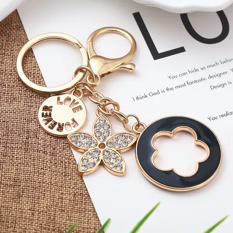Portachiavi In Metallo Alla Moda Trifoglio A Quattro Foglie Strass Fiore Smaltato Borsa Pendente Ciondolo Donne Anello Chiave Regalo