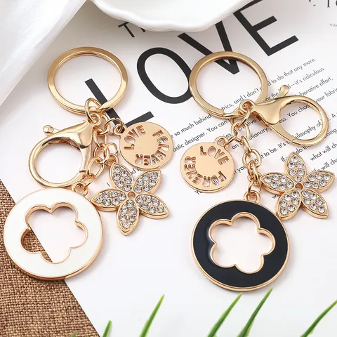 Portachiavi In Metallo Alla Moda Trifoglio A Quattro Foglie Strass Fiore Smaltato Borsa Pendente Ciondolo Donne Anello Chiave Regalo