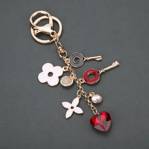 Portachiavi a Forma di Cuore e Trifoglio a Quattro Foglie Lusso Leggero Lega Placcata Oro Ciondolo Borsa Moda Carino Anello Chiave Regalo per Donna