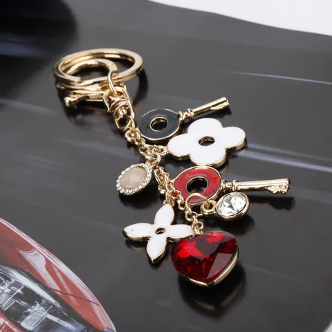 Portachiavi a Forma di Cuore e Trifoglio a Quattro Foglie Lusso Leggero Lega Placcata Oro Ciondolo Borsa Moda Carino Anello Chiave Regalo per Donna