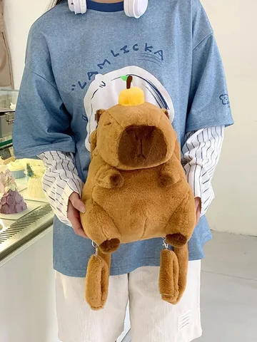 Zaino Peluche Capibara Cartone Animato per Bambini Marrone Animale Morbida Borsa Giocattolo con Accessorio Arancione Squisito Zaino da Viaggio