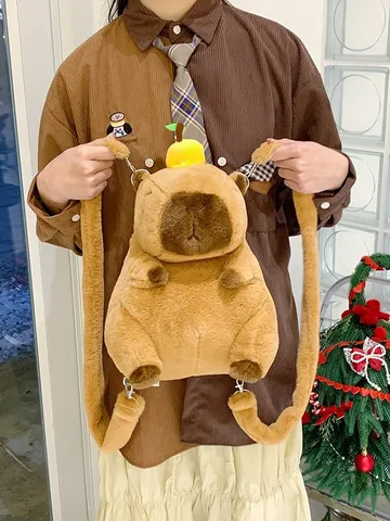 Zaino Peluche Capibara Cartone Animato per Bambini Marrone Animale Morbida Borsa Giocattolo con Accessorio Arancione Squisito Zaino da Viaggio