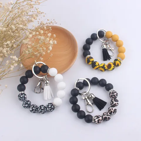 Porte-Clés Bracelet en Perles de Silicone Avec Gland en Similicuir Imprimé Léopard Tournesol Tête de Mort Anneau de Poignet Pour Clés Voiture Sac Accessoires