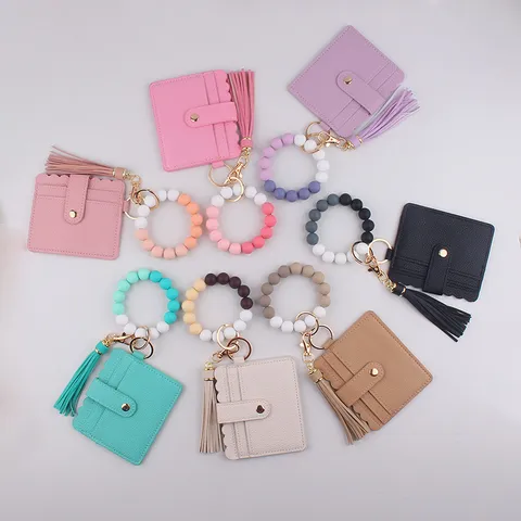 Porte-Clés Bracelet en Perles de Silicone Porte-Cartes en Cuir PU Portefeuille Couleur Unie Anneau Clé Avec Gland pour Femmes Hommes
