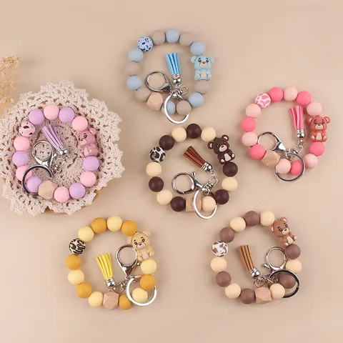 Süßer Cartoon 3D Bär Silikon Holzperlen Schlüsselanhänger Armband Mit Lederquaste Metall Schlüsselring Anhänger Für Damen Auto Tasche