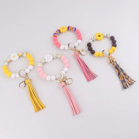 Silikon Perlen Schlüsselanhänger Armband Mit Kunstleder Quaste Blume Gänseblümchen Handgelenk Band Schlüsselring Armband Halter Für Frauen Handtasche Tasche Anhänger Zubehör