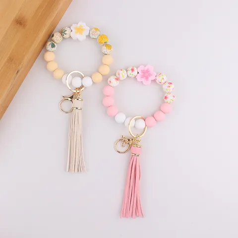 Silikon Perlen Schlüsselanhänger Armband Mit Kunstleder Quaste Blume Gänseblümchen Handgelenk Band Schlüsselring Armband Halter Für Frauen Handtasche Tasche Anhänger Zubehör