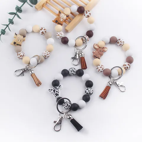 Llavero de Cuentas de Silicona de Vaca Animada con Borla de Cuero PU Colgante de Bolso Correa de Muñeca Accesorio Lindo
