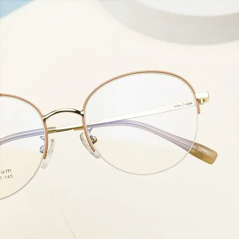 Montatura per Occhiali Tonda Semi-Rimless in Lega di Titanio Occhiali da Vista Retro Moda Montatura in Metallo